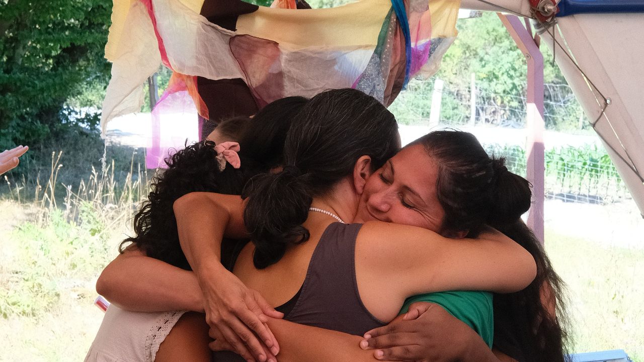 Roundtable speakers hugging