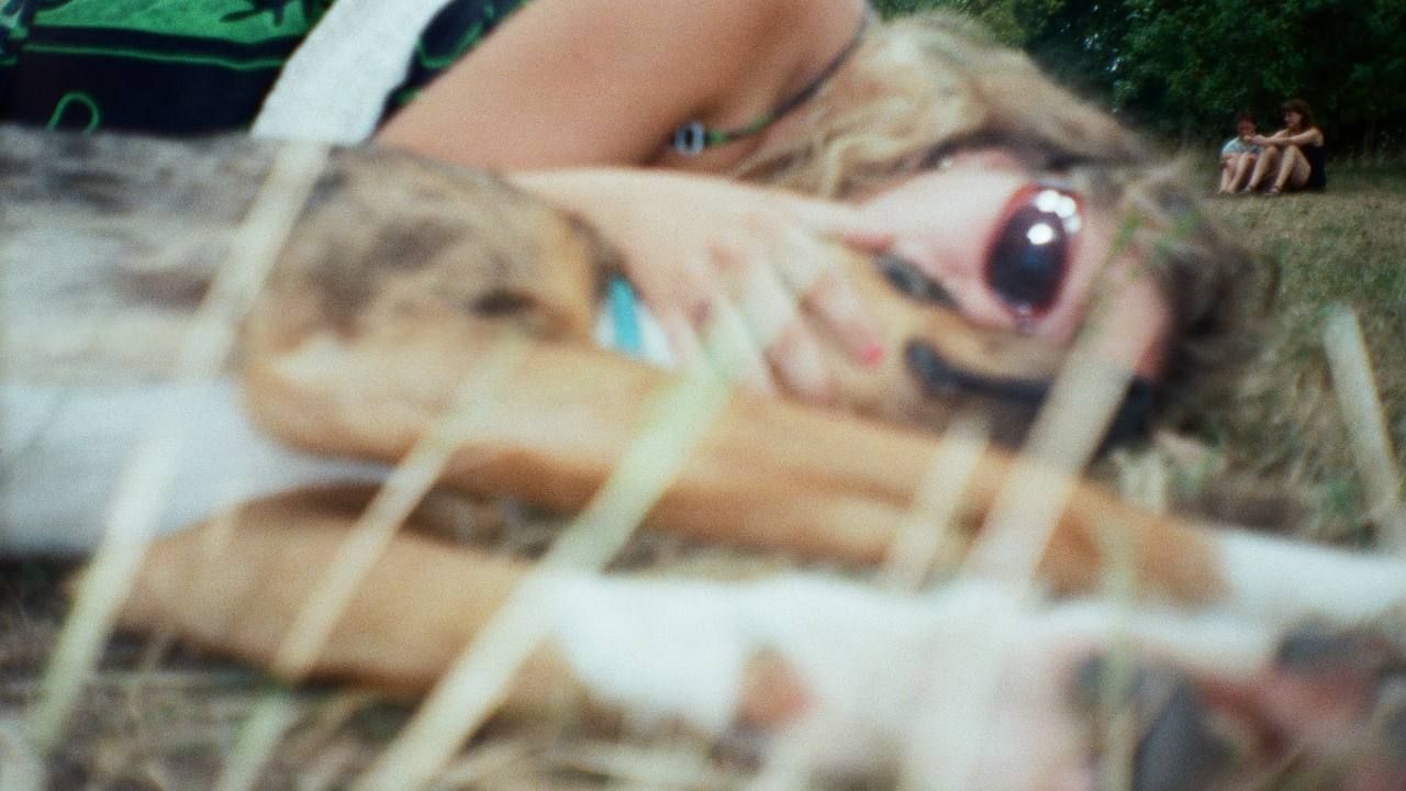 Person and dog lying down cuddling