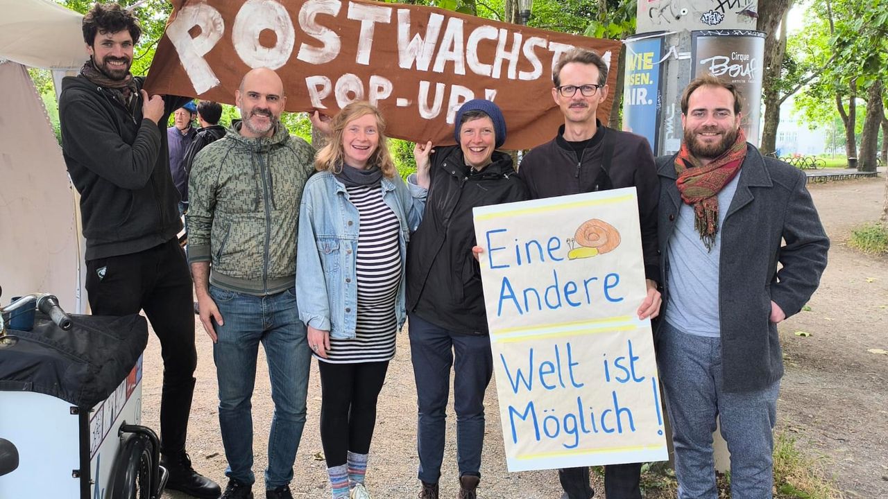 Some of our members celebrate on Global Degrowth Day our first pop-up stall and website launch