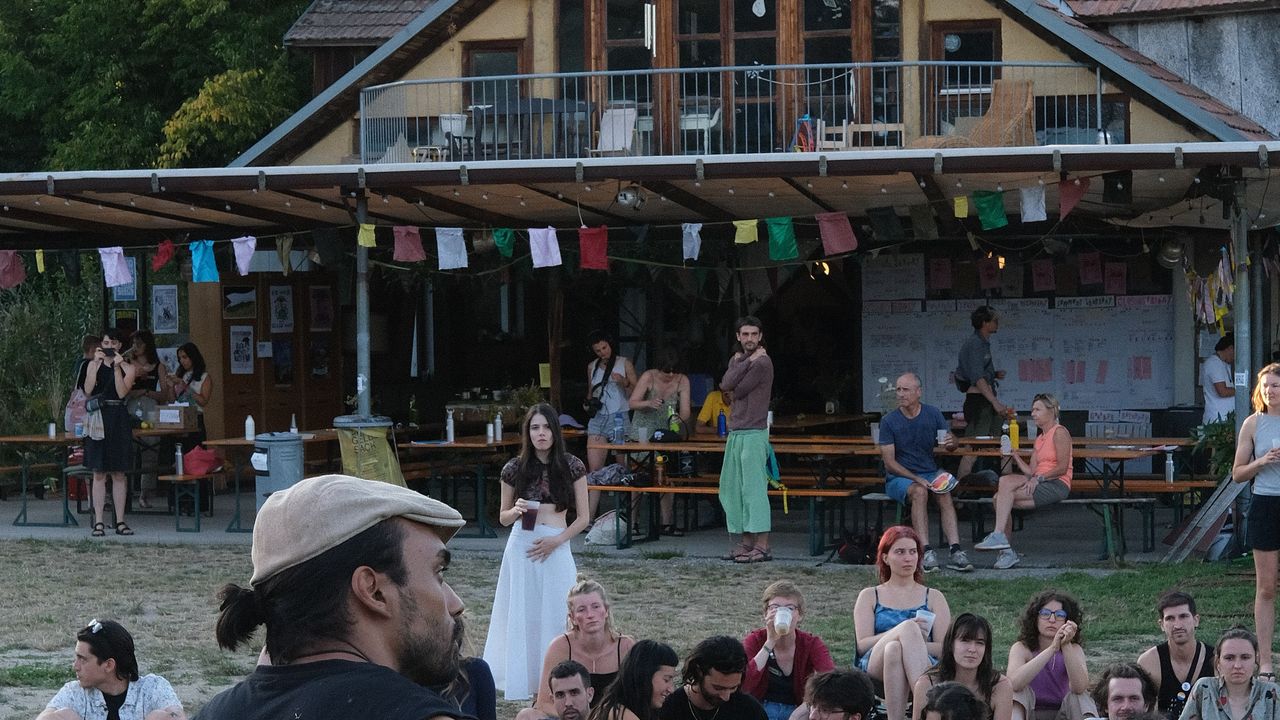 Band performing at outdoor stage during the afternoon